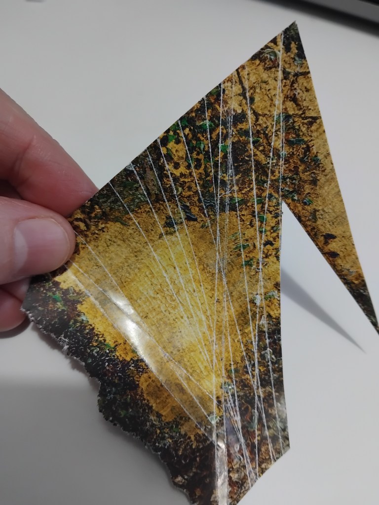 Piece of magazine page with multiple folds